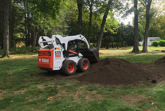 Skid steer material moving